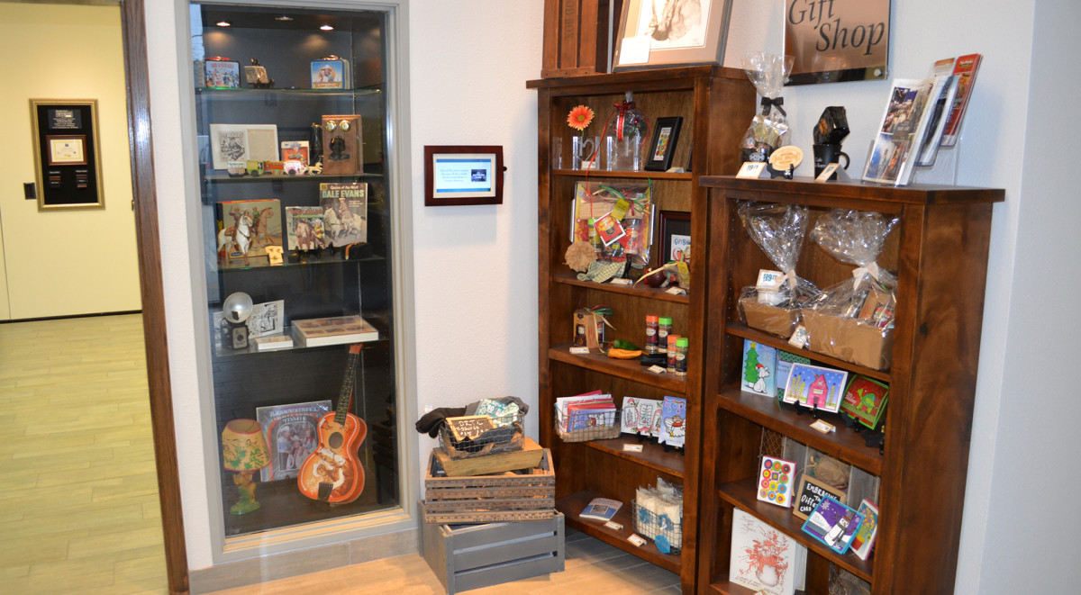 Two shelves display items for sale in Robin's Corner Gift Shop at Dale Rogers Training Center.