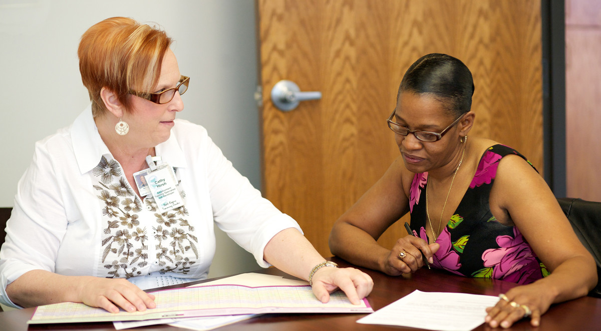 Employment Training Specialist Cathy (left) helps an individual find a job through DRTC's Employment Services Program